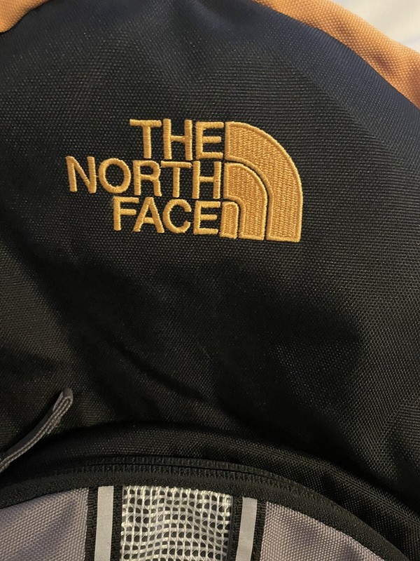 The North Face Cato’s Logo Small Black & Gold Backpack  2
