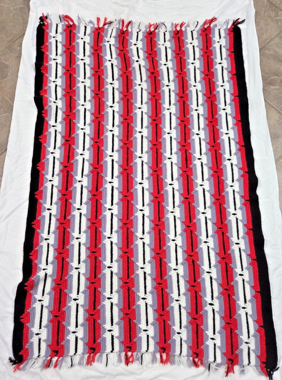 VINTAGE HAND CROCHETED BLACK/RED/GREY/WHITE TRIBAL PATTERN AFGHAN gallery