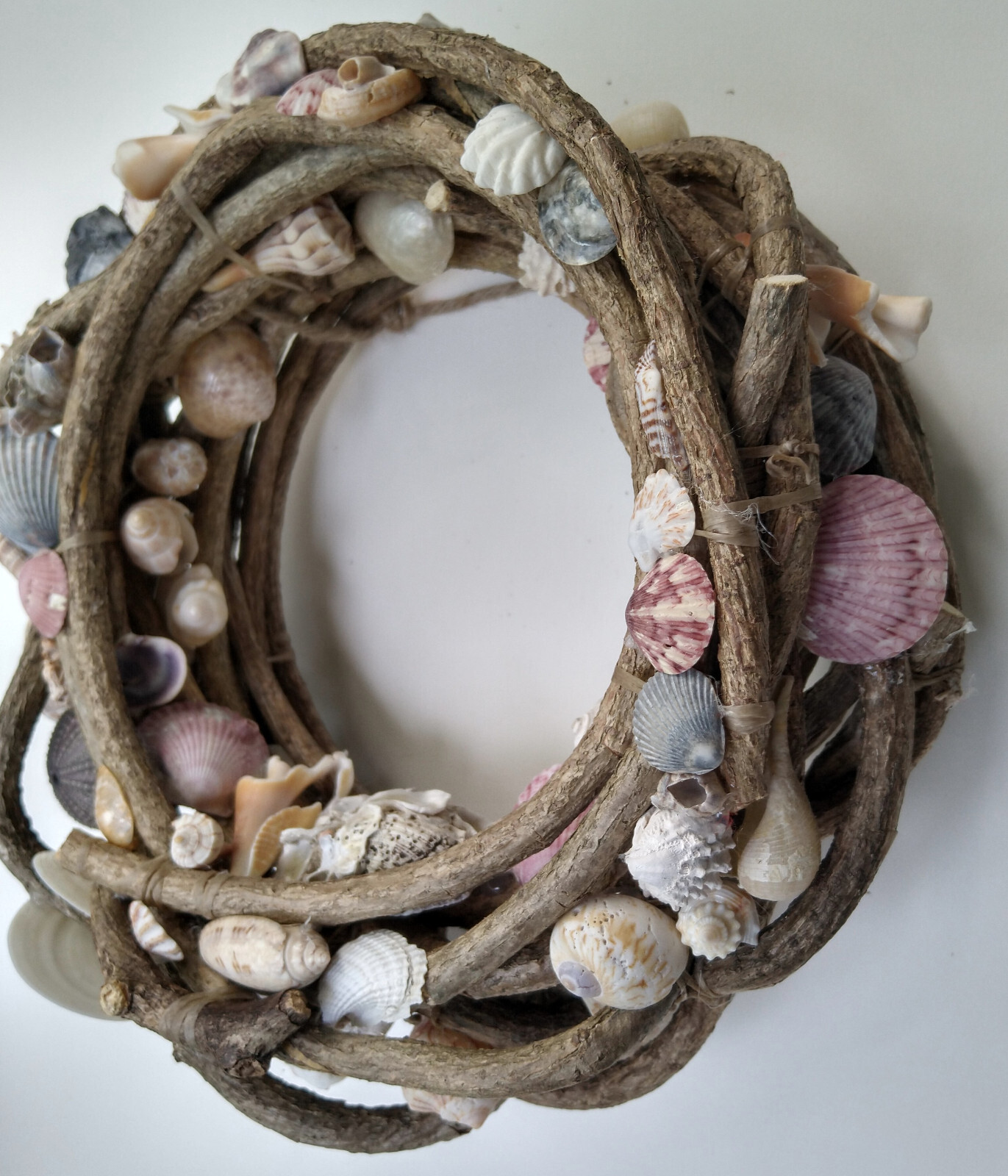 Beautiful hand made 10" vine wreath with natural found seashells gallery