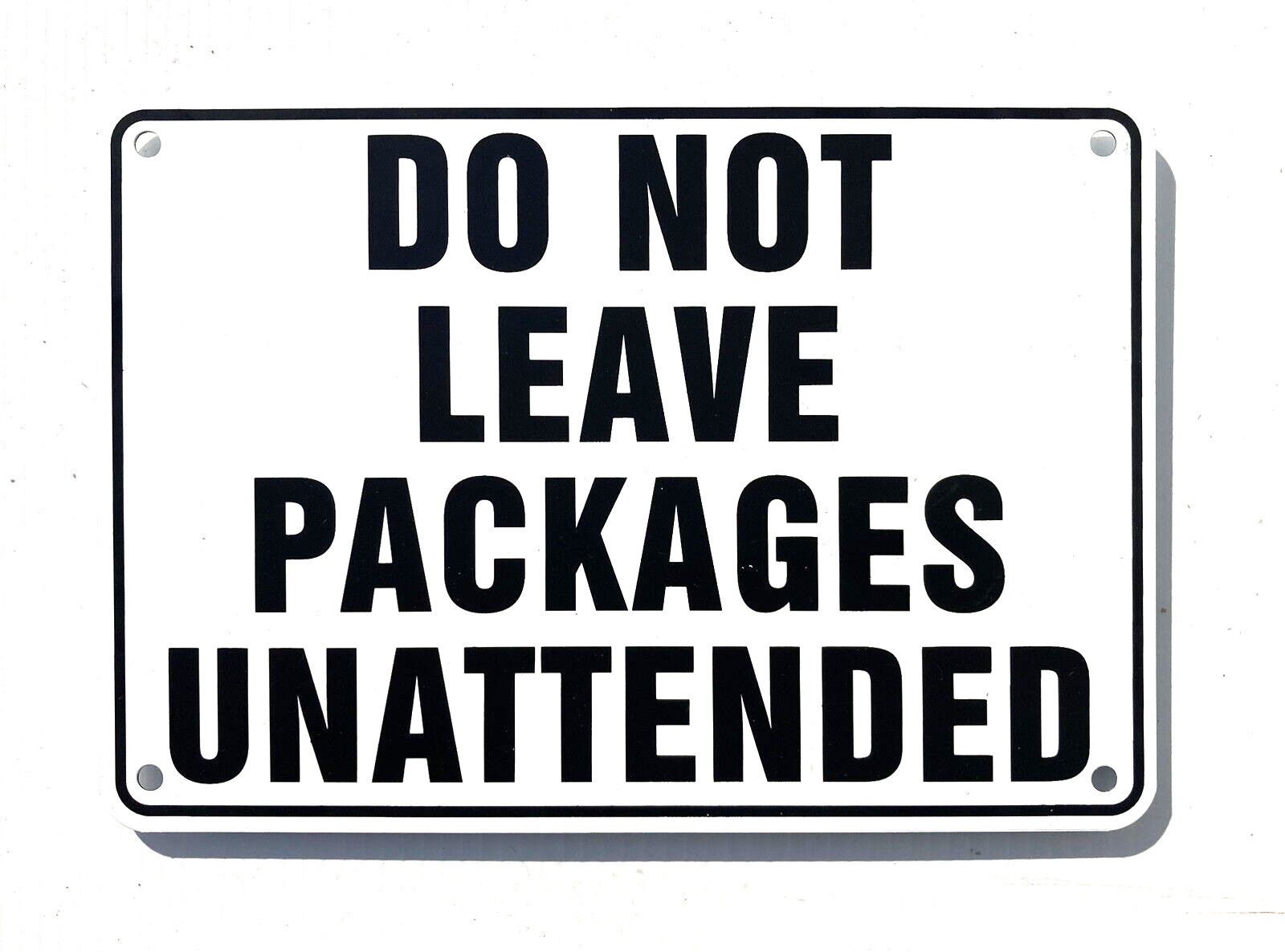 "DO NOT LEAVE PACKAGES UNATTENDED" WARNING SIGN, METAL, HEAVY DUTY gallery