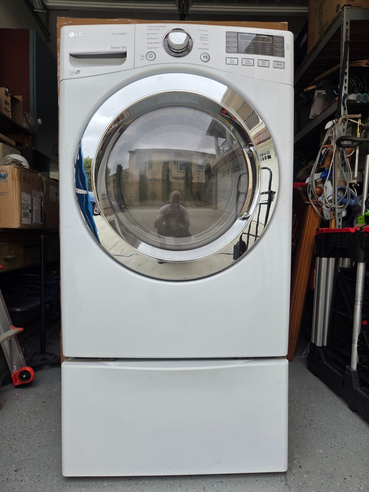 Used LG white front loading gas dryer in very good condition includes stand gallery