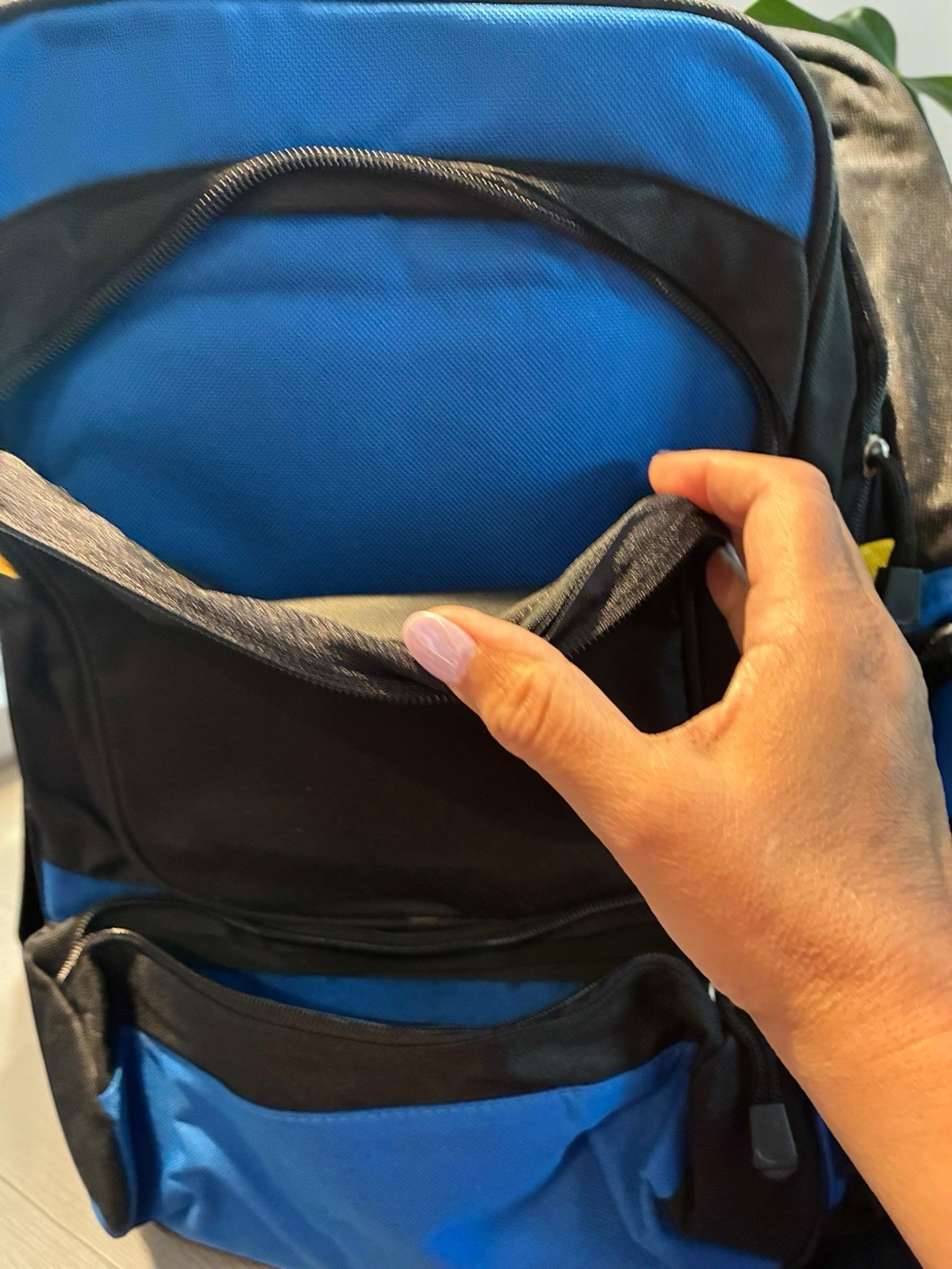 Black And Blue Backpack With Many Pockets. 4