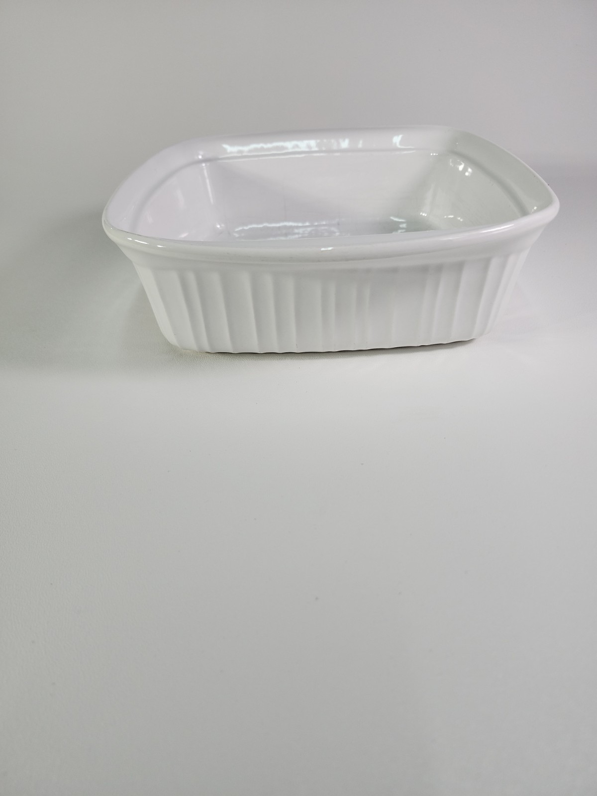 This is a Corning Ware French White square casserole baking dish 8×8 gallery