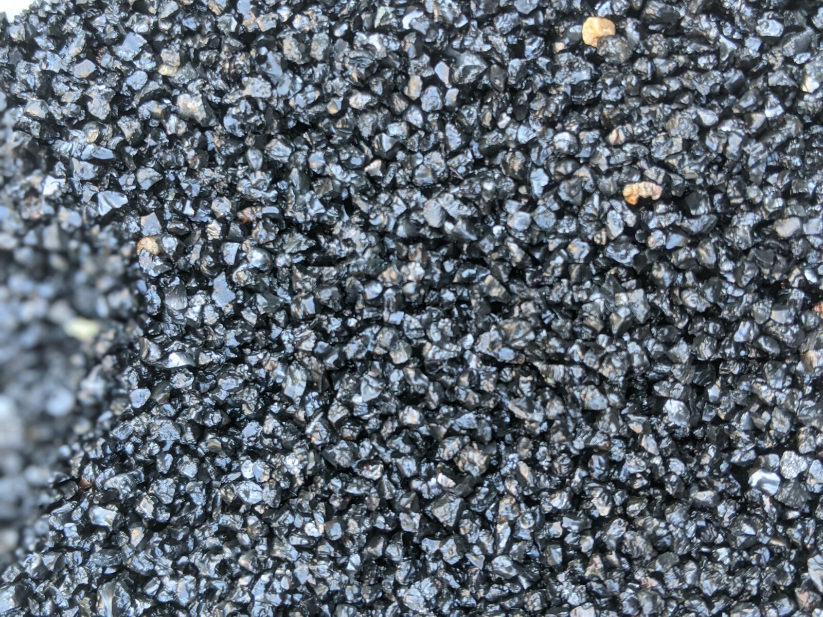 Natural shiny coarse black sand gallery