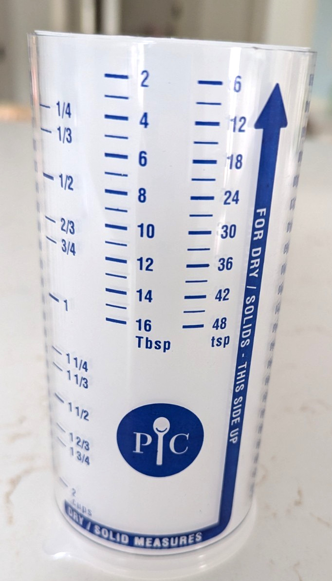 New Pampered Chef Measure All Cup Adjustable Plunger Design, 2 Cup Capacity 2225 gallery