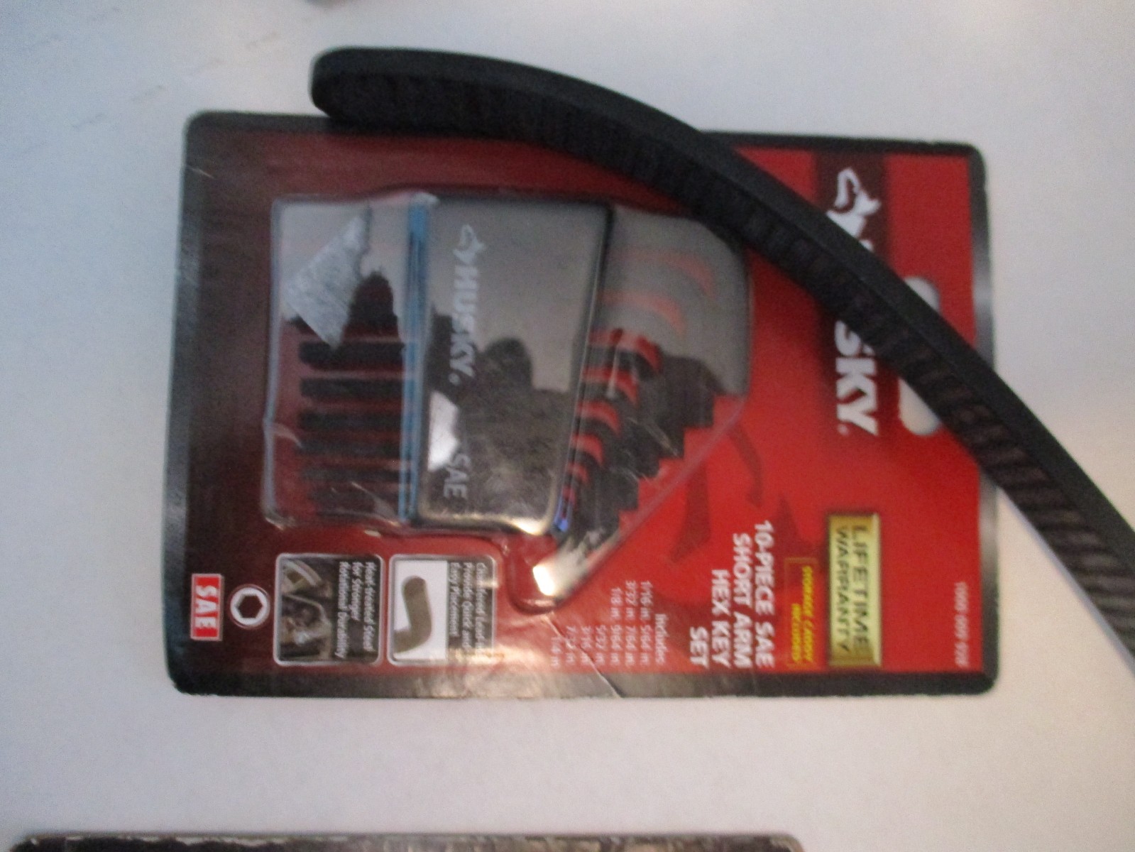 Husky 8 In. Strap Wrench, Plug Wrench, Coupler, Hex Key Set, 3 in 1 Caulk Tool gallery