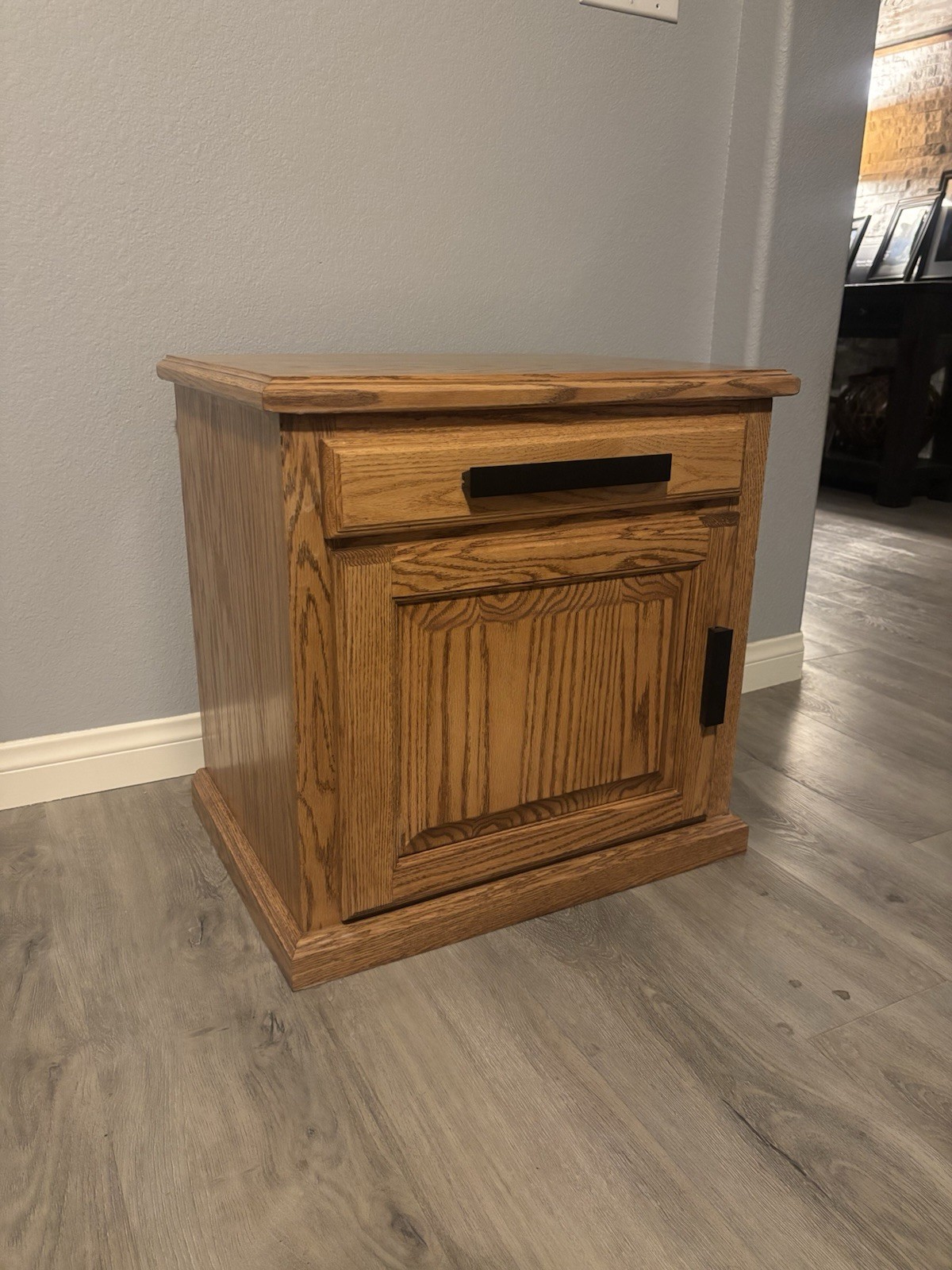 Traditional Medium Brown Wood Nightstand with Drawer, Cabinet, Black Handle gallery