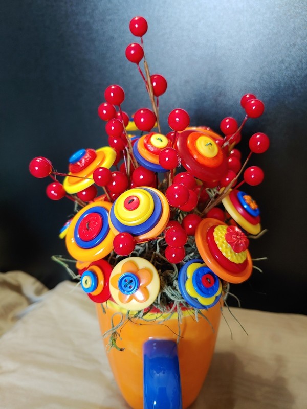 Bright Button Bouquet in Orange Coffee Mug. Red, orange, yellow. fun and playful gallery