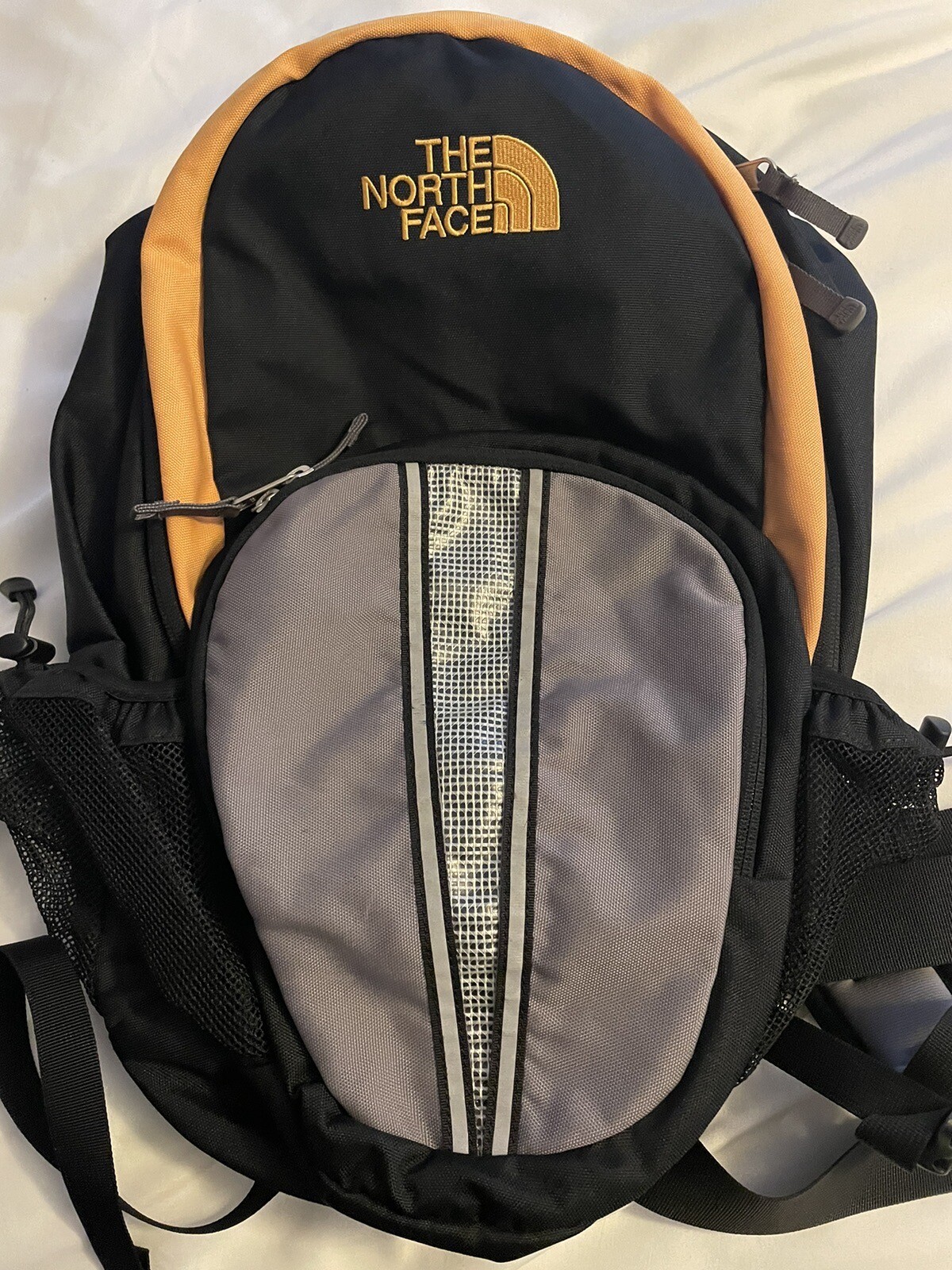 The North Face Cato’s Logo Small Black & Gold Backpack