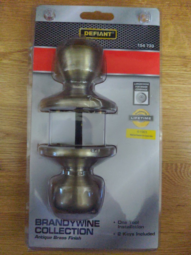 Defiant • Brandywine Collection • Door Knob • Keyed • Antique Brass Finish