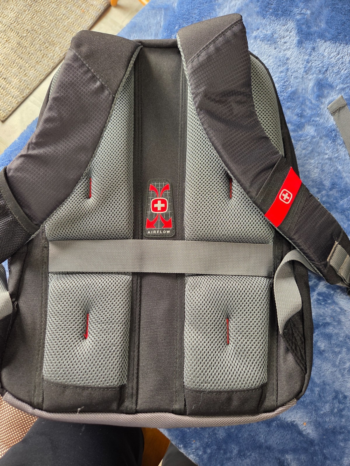 Swiss Gear black backpack with AXA logo