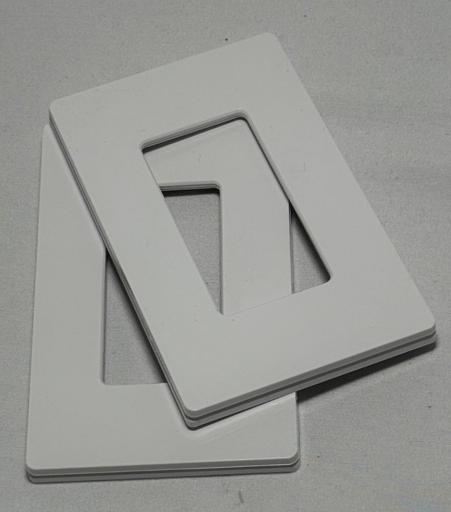 Two LUTRON WALLPLATE No Visible Screws. White/Blanco. Claro. Gloss Finish.