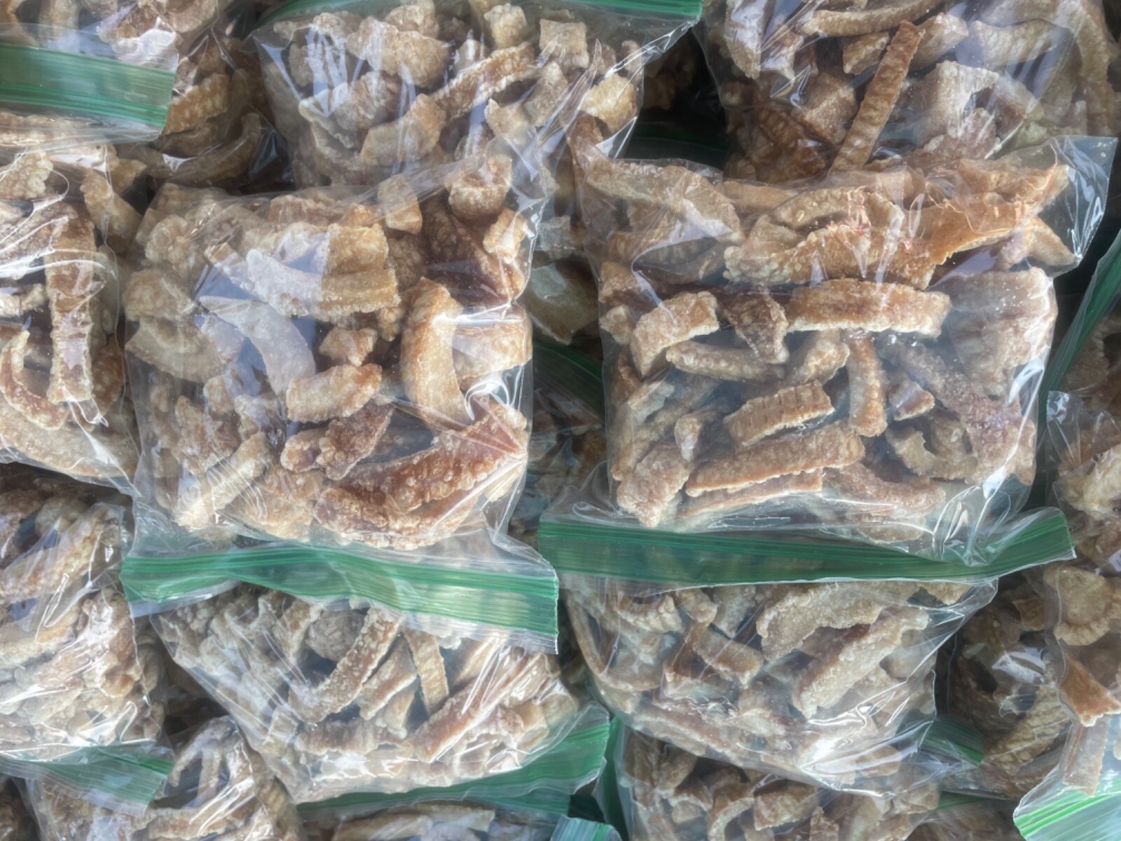 Carolina Style pork cracklins/ FATBACK STYLE fried pork fat with skin.. Fresh gallery
