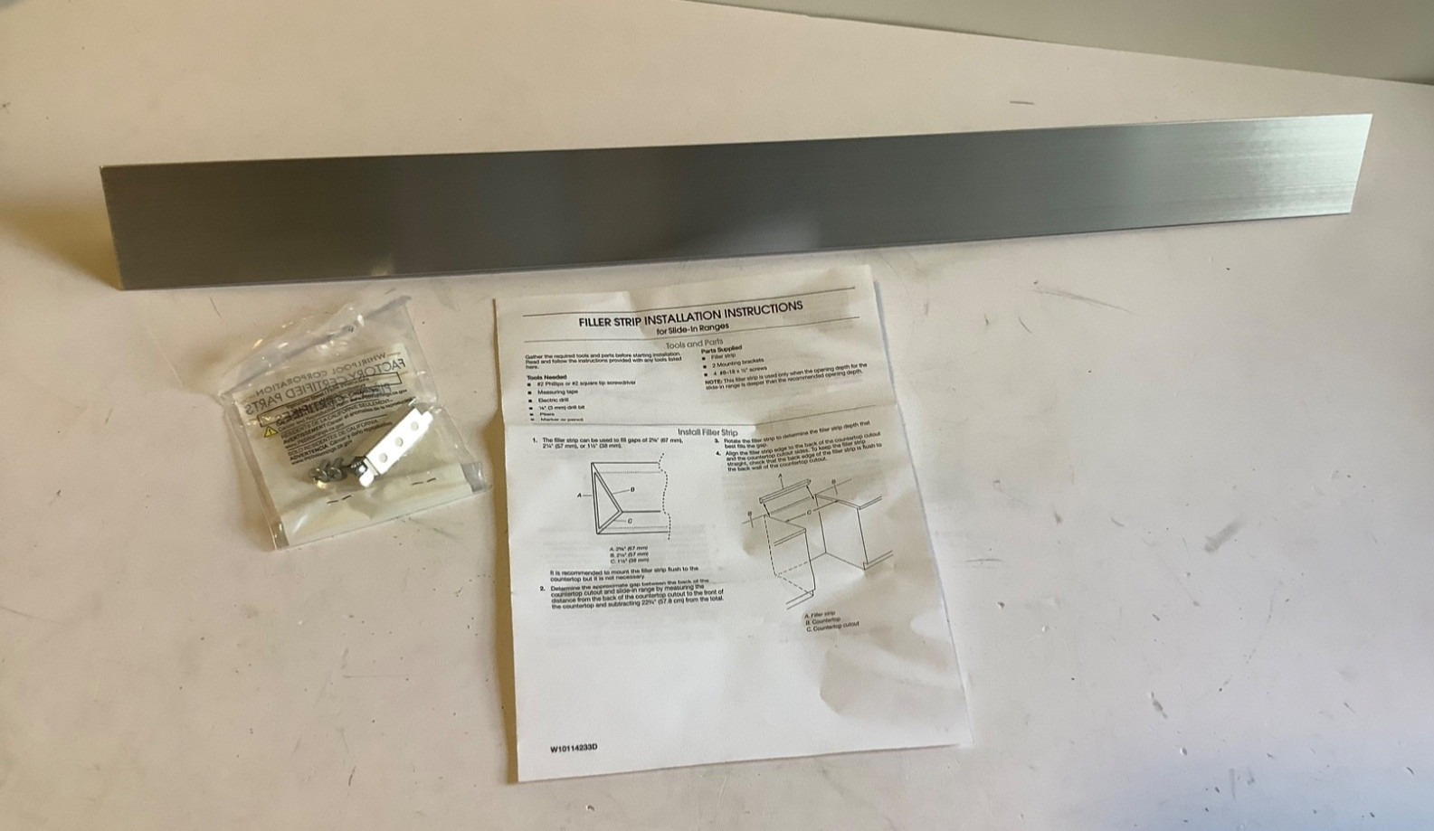 Whirlpool W10113901A Triangular Filler Strip Stainless Steel Trim OEM gallery