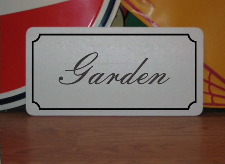 Garden Metal Sign in Fancy Script and Black Border gallery