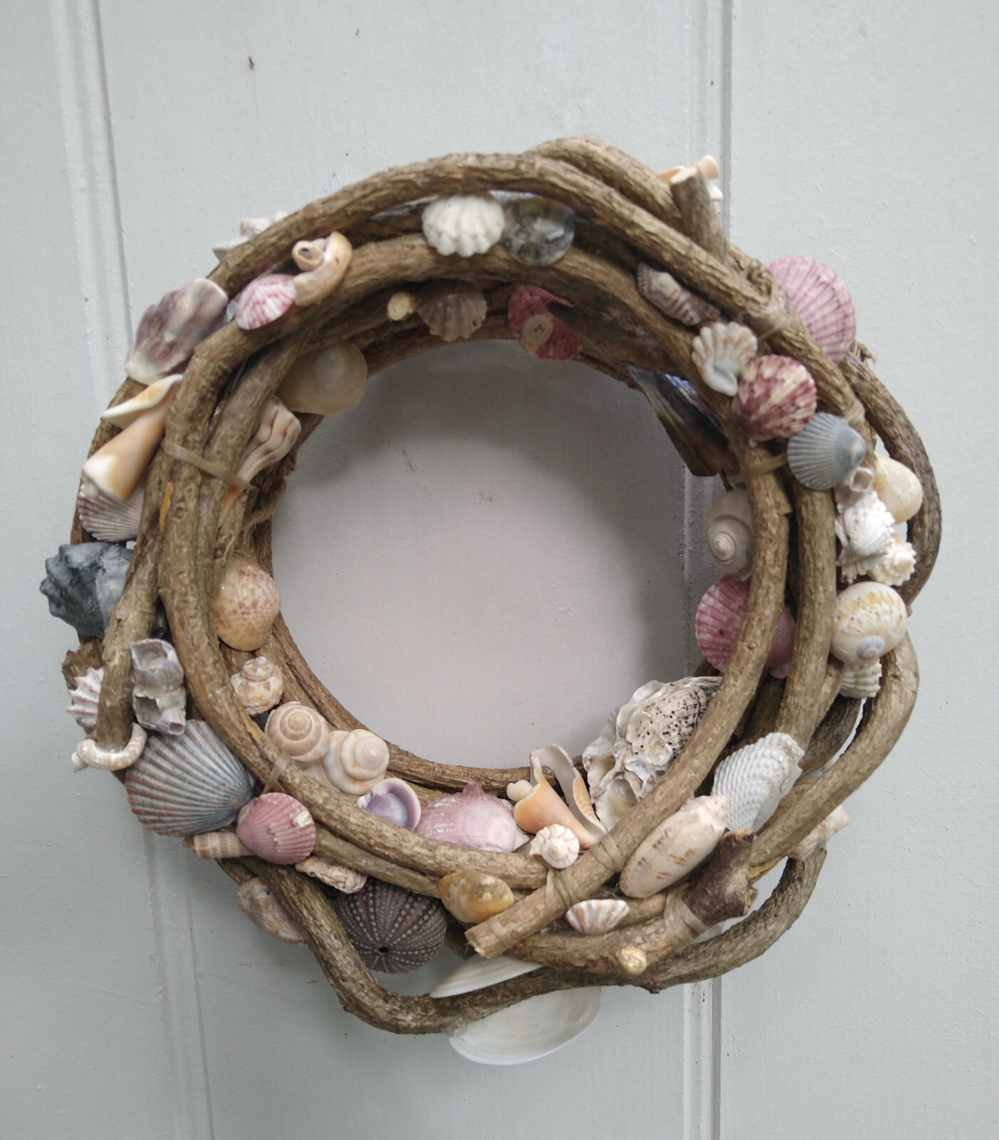 Beautiful hand made 10" vine wreath with natural found seashells gallery