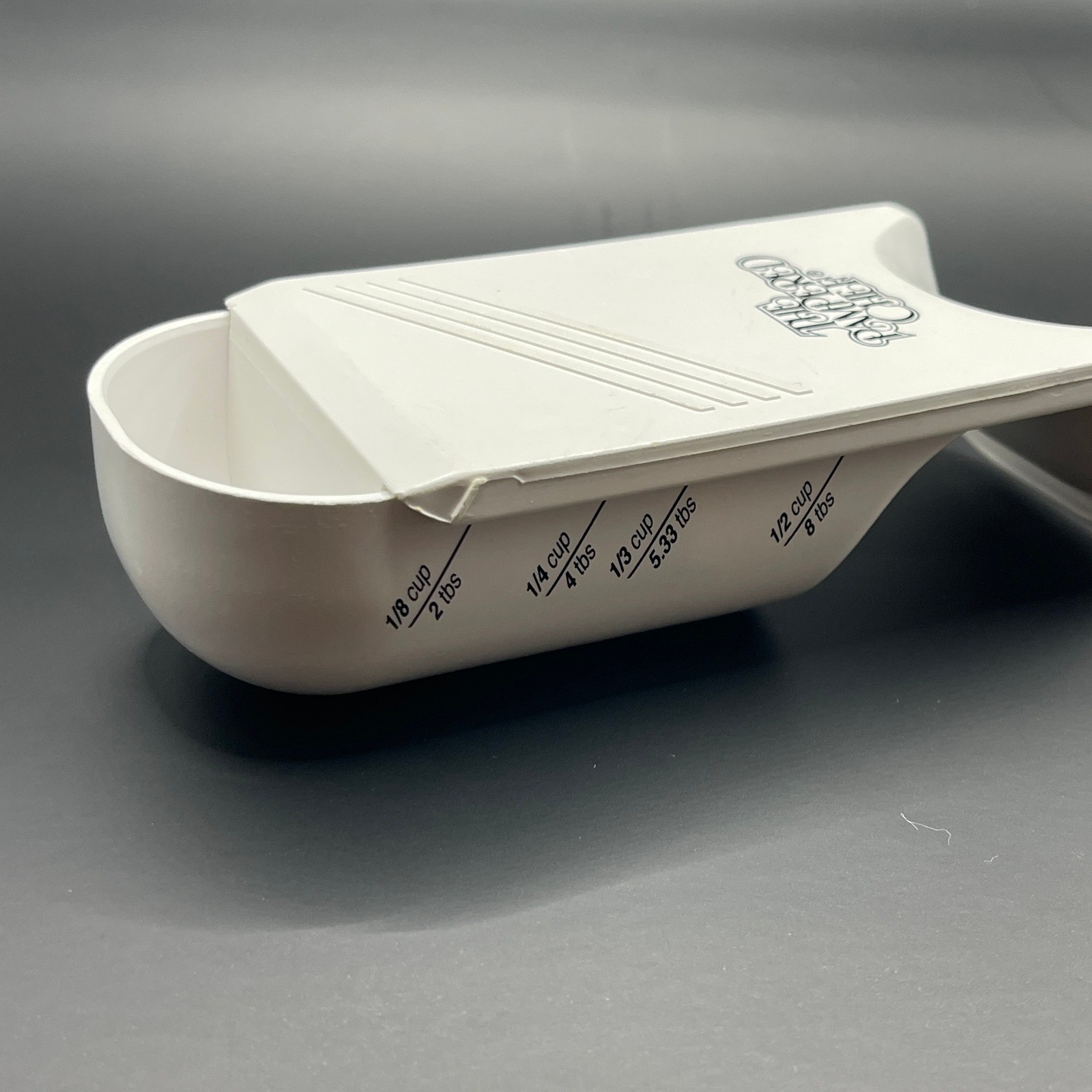 The Pampered Chef Adjustable Measuring Cup White Plastic 1/2 Cup 125ml USA made gallery