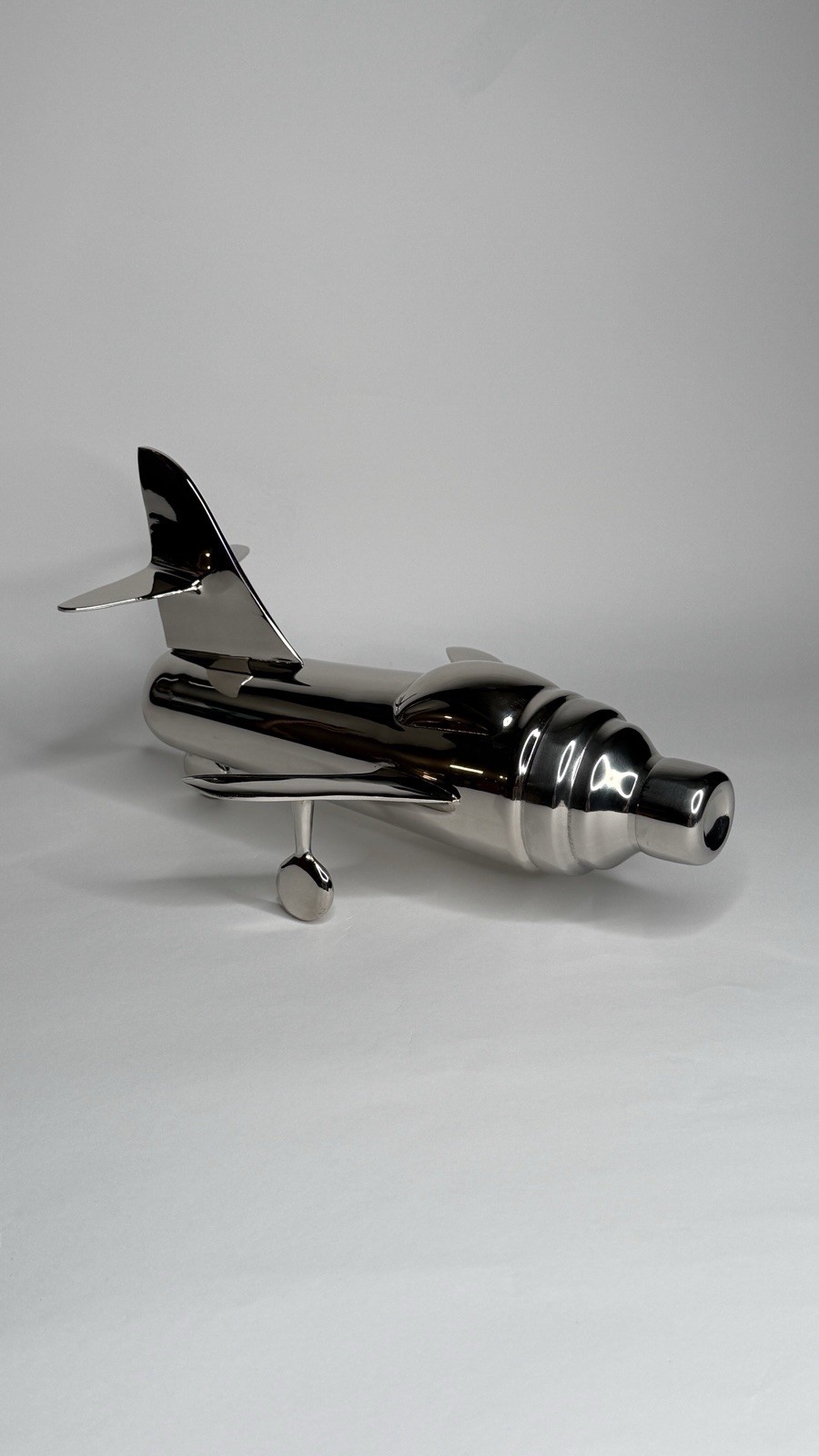 CB2 "Take Off" airplane-shaped cocktail shaker designed by Brett Beldock gallery