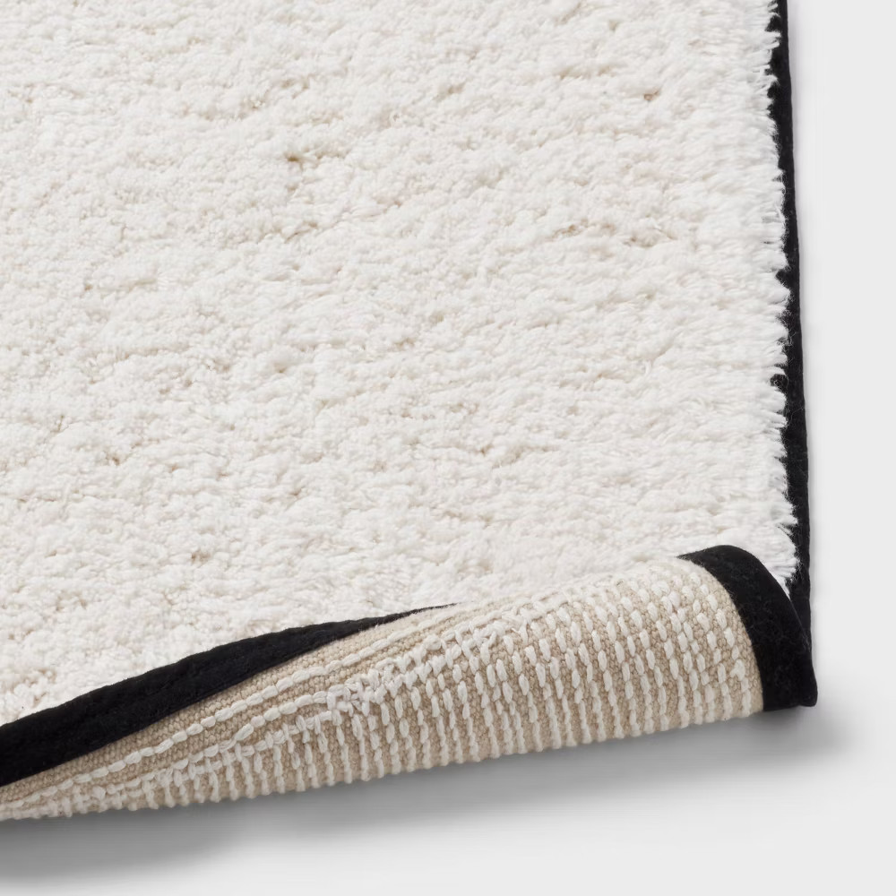 24"x36" Oversized Border Bath Rug Black/White - Threshold gallery