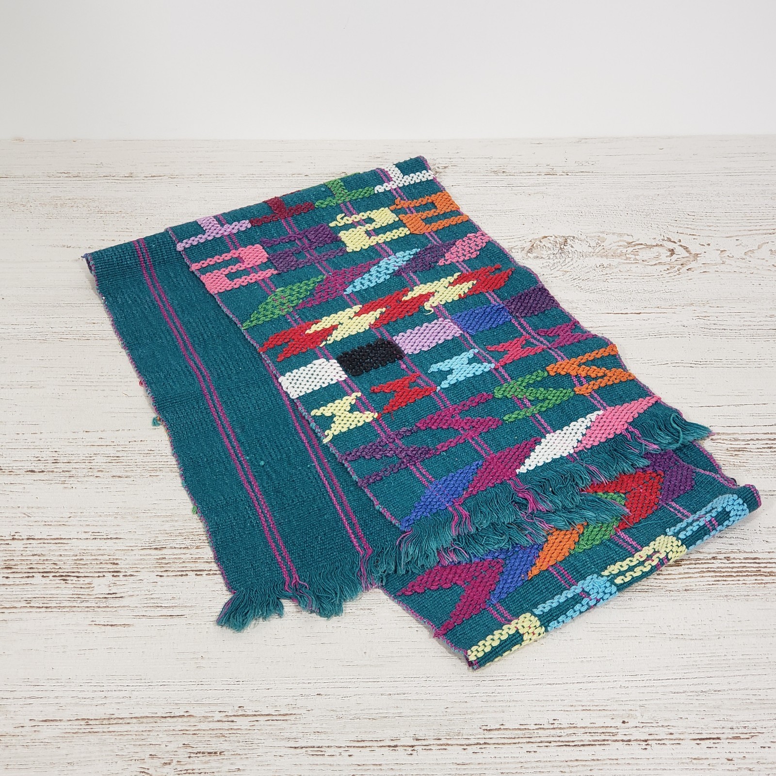 Handwoven Colorful Table Runner Teal background with lots of other primary color gallery