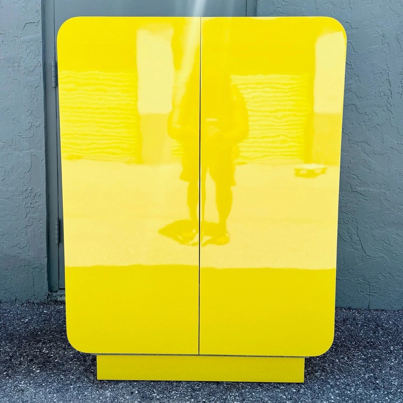 Postmodern Yellow Gloss Laminate Waterfall Cabinet With Gold Accents gallery