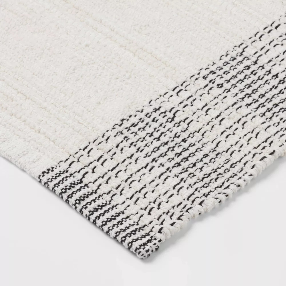 24"x36" Oversized Modern Chenille Bath Rug Black/White - Threshold gallery