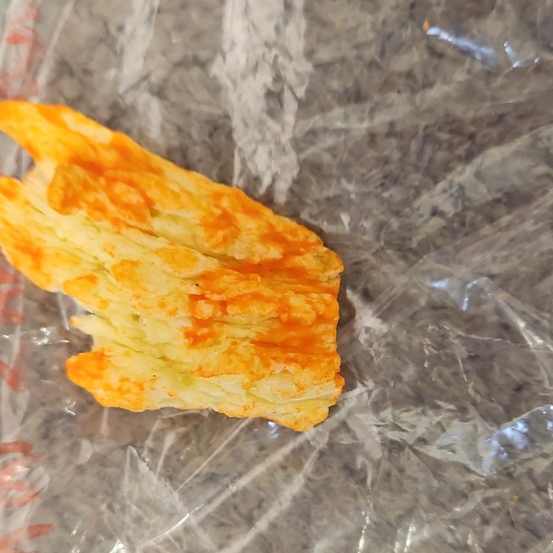 Single Cheese-Flavored Puffed Snack Piece (Cheetos-Style) in Plastic Bag gallery