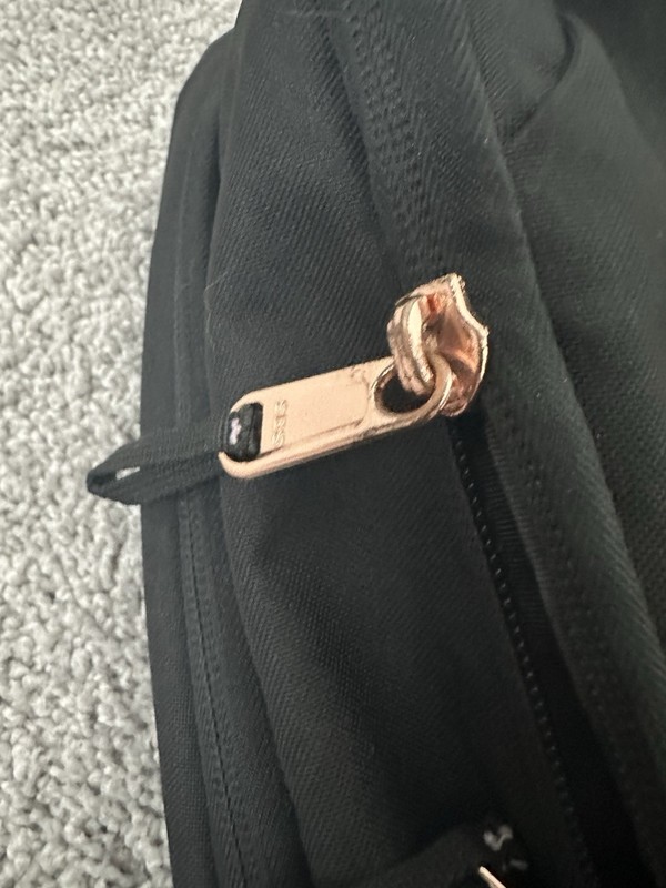 The North Face Jester Black Back Pack With Copper Looking Zippers 2