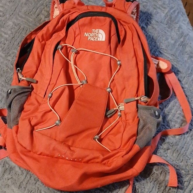 The North Face Jester Orange Hiking Backpack Zip Adjustable Padded Polyester
