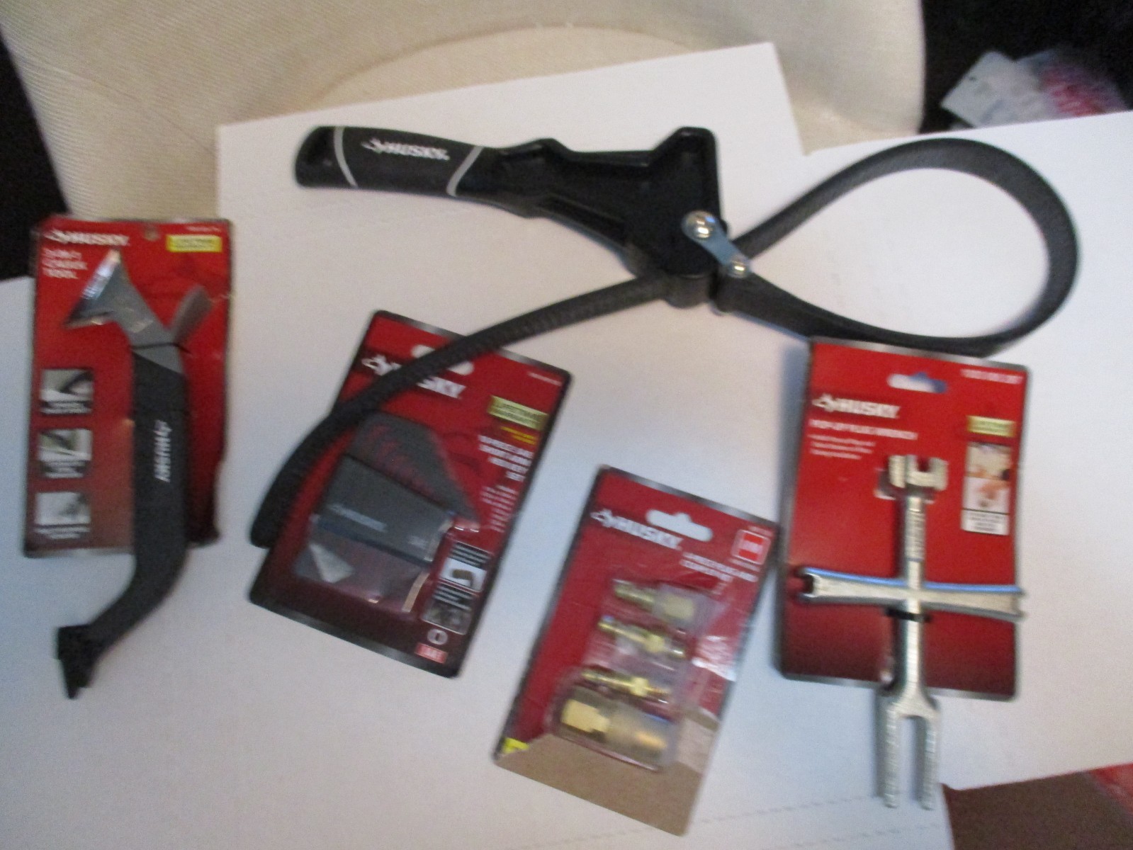 Husky 8 In. Strap Wrench, Plug Wrench, Coupler, Hex Key Set, 3 in 1 Caulk Tool gallery