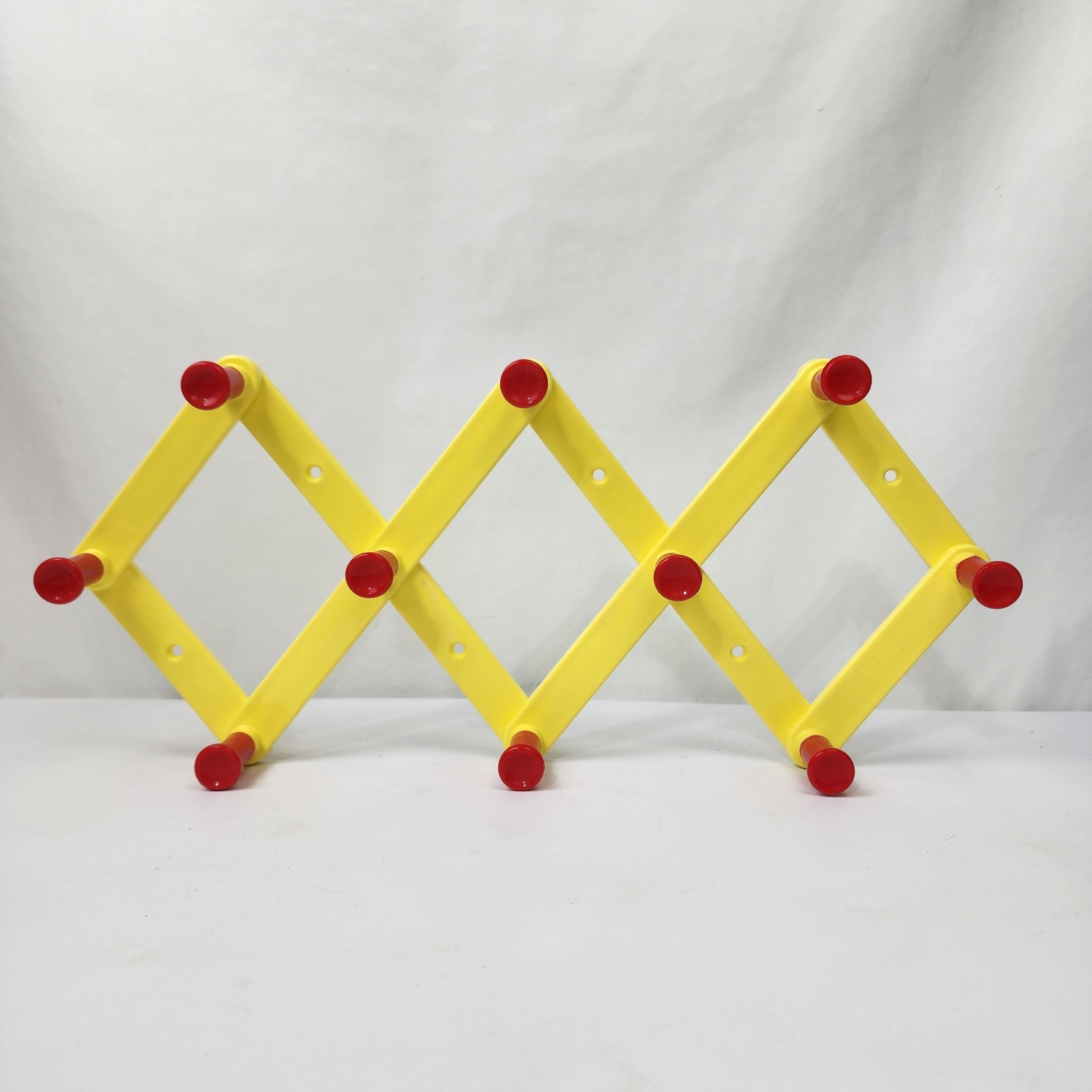 Accordion Expandable Hanging Wall 10 Peg Hook Plastic Yellow Red Primary Color gallery