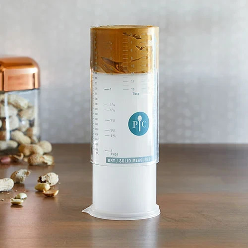 New Pampered Chef Measure All Cup Adjustable Plunger Design, 2 Cup Capacity 2225 gallery