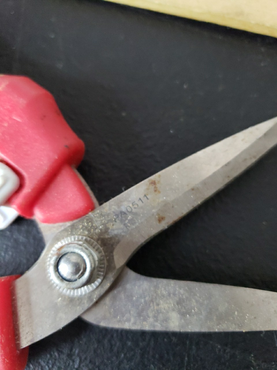 Fiskars Brand Garden Pruner With Red and Tan Handles. gallery