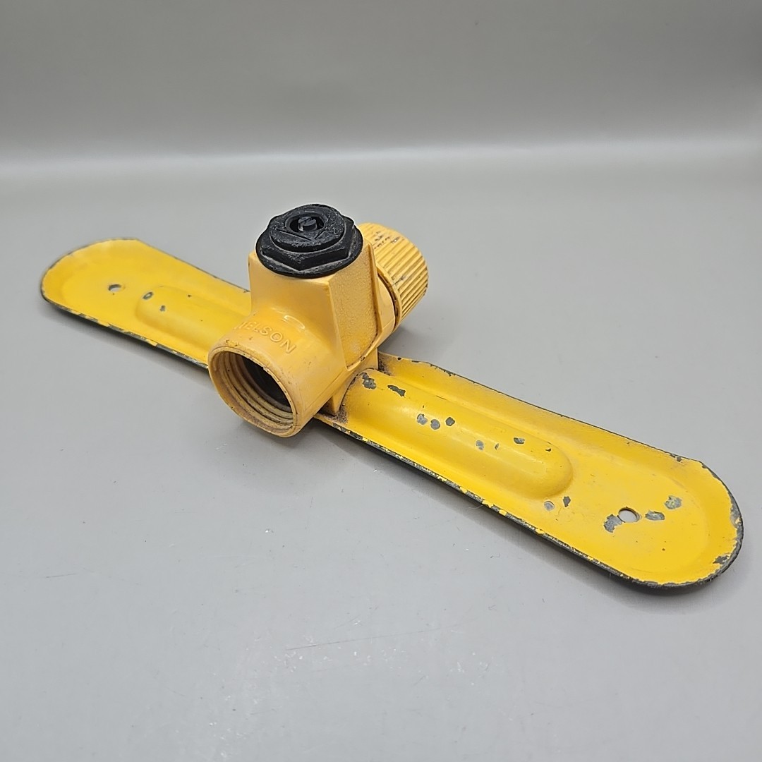 Vintage Nelson Yellow Metal And Plastic In-Line Lawn Sprinkler With Cap gallery