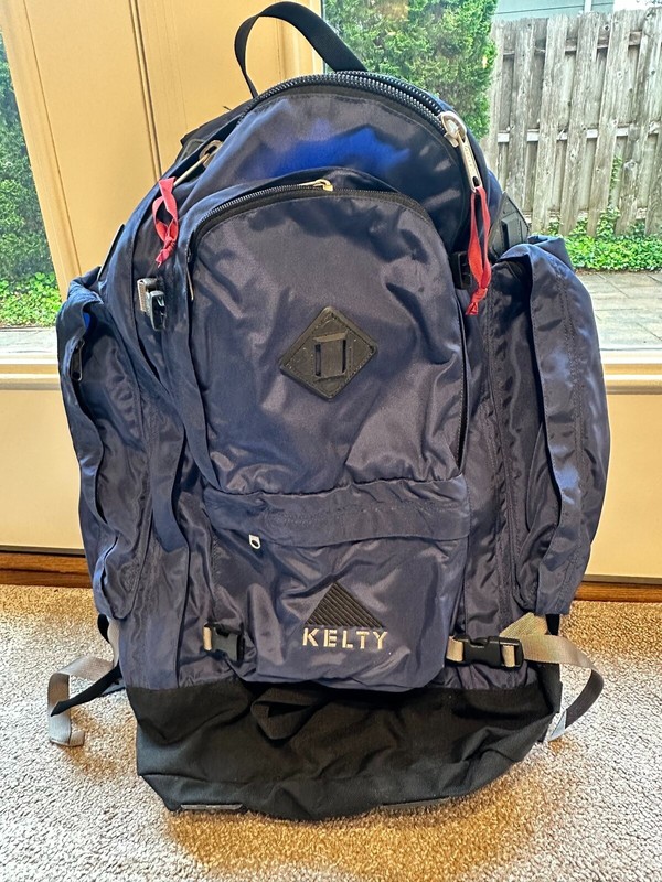 Medium-large hiking backpack, navy/black, padded straps. Used condition. 2