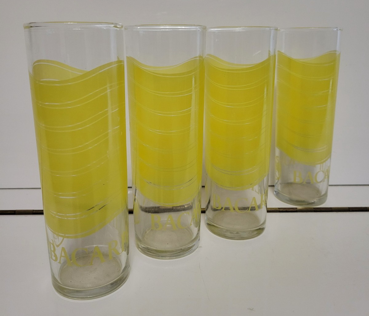 4 BACARDI LIMON HIGHBALL TOM COLLINS GLASSES YELLOW BANDS 7 INCHES HOLDS 12 OZS gallery