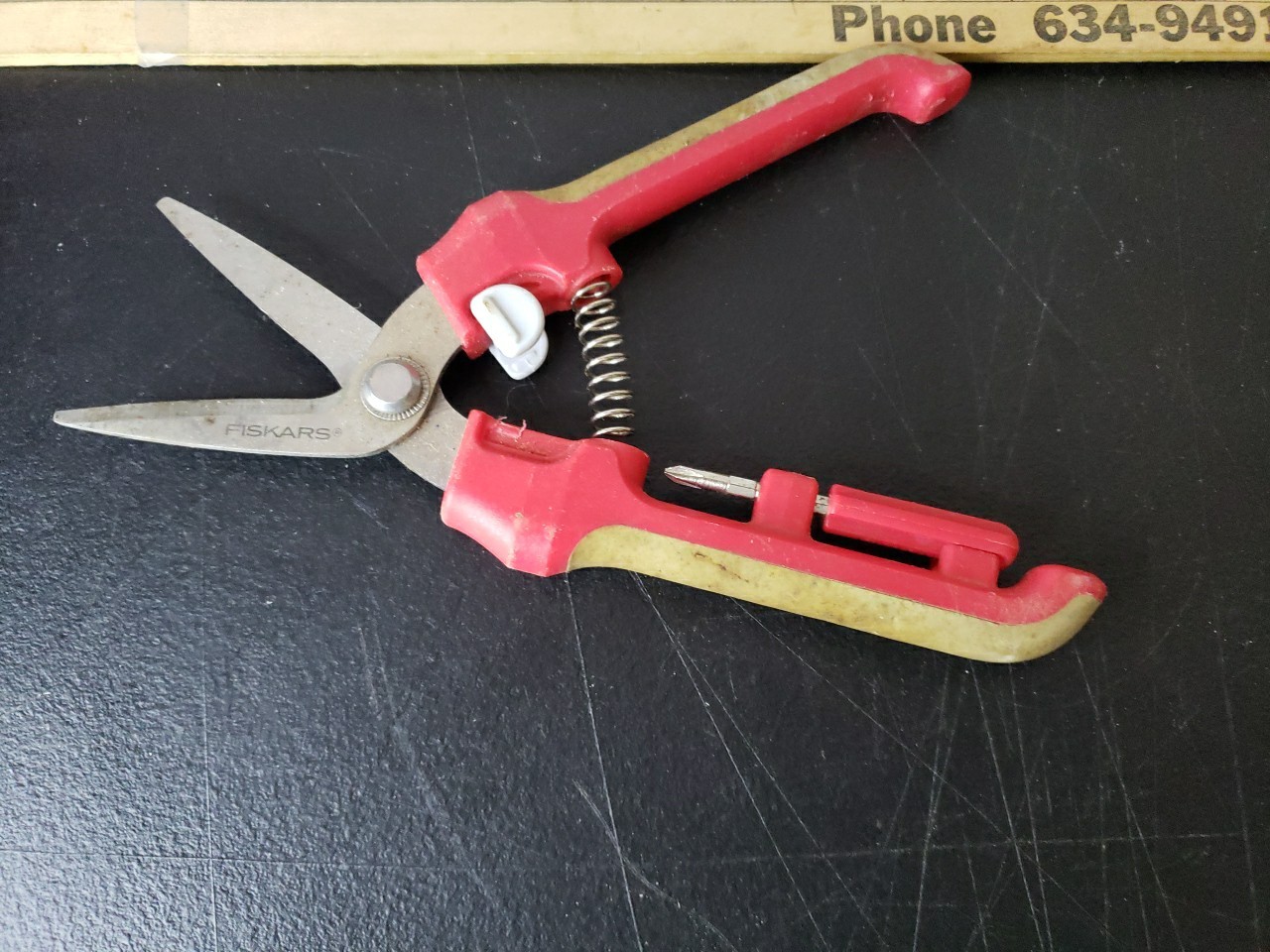 Fiskars Brand Garden Pruner With Red and Tan Handles. gallery