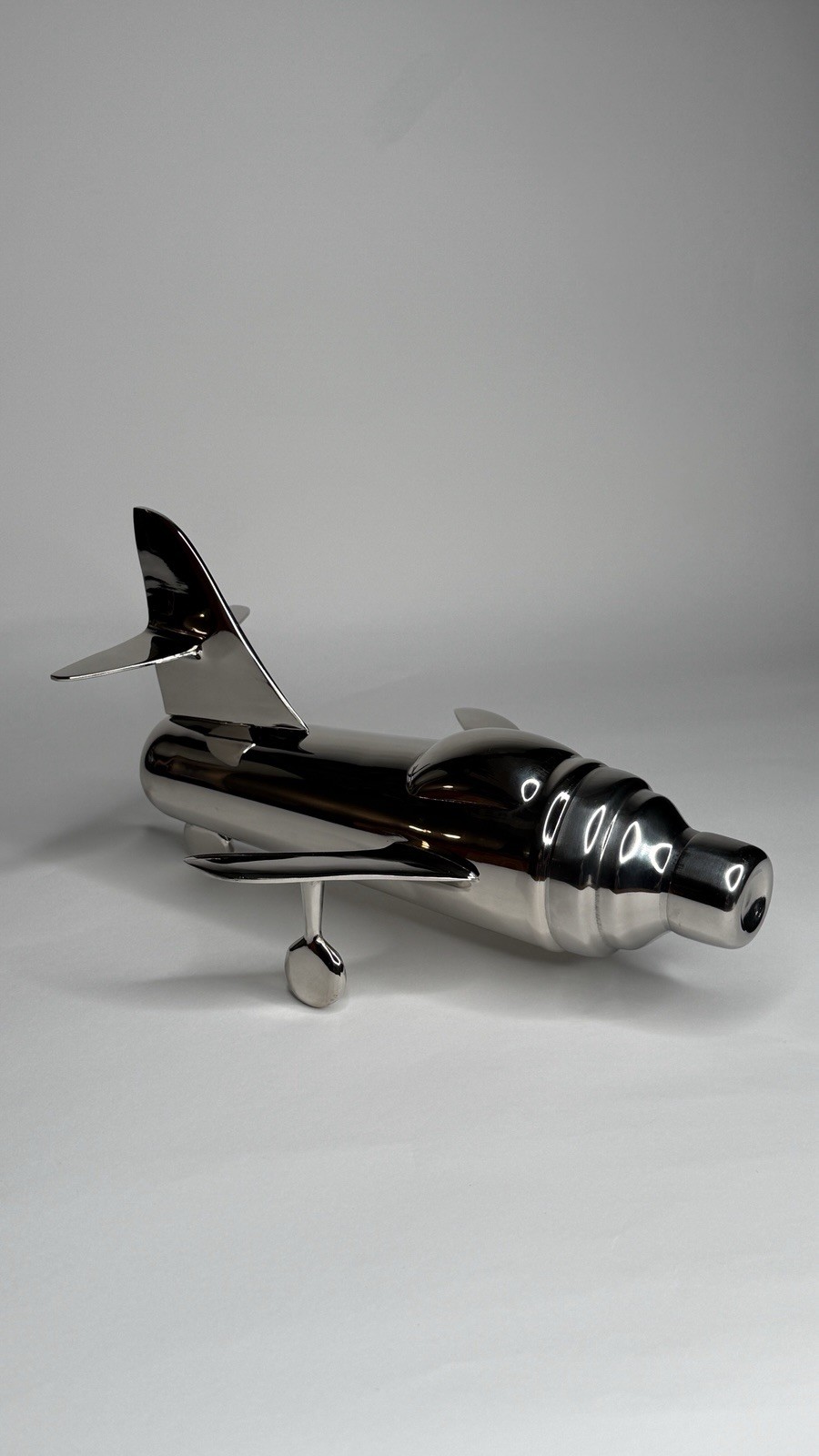 CB2 "Take Off" airplane-shaped cocktail shaker designed by Brett Beldock gallery