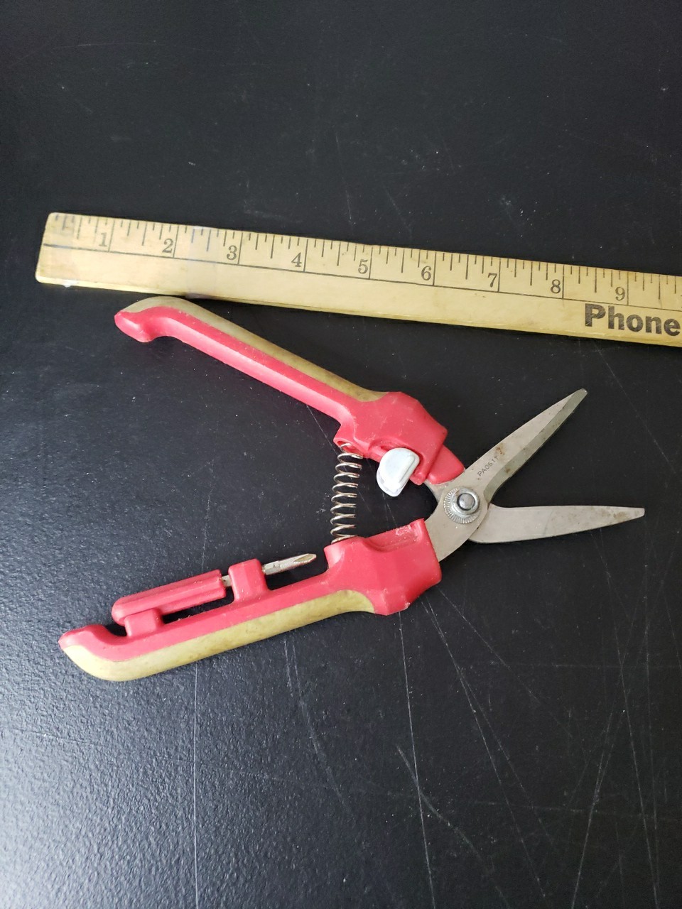 Fiskars Brand Garden Pruner With Red and Tan Handles. gallery