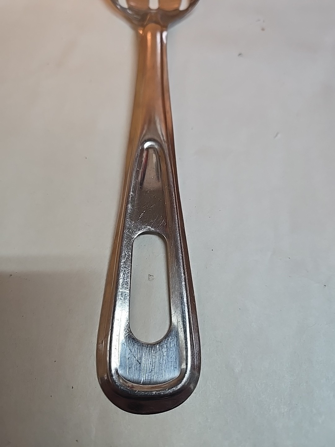 Tablecraft Stainless Steel 11" Slotted Serving Spoon; India gallery