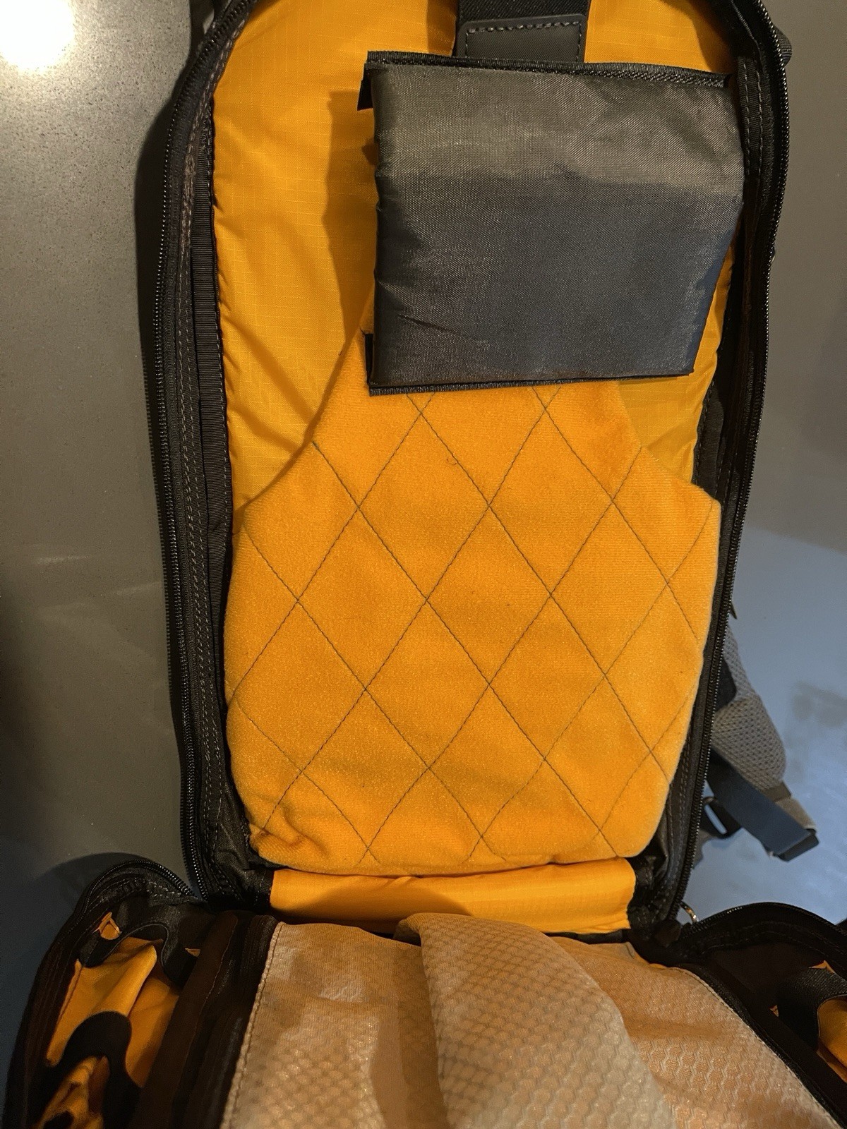 Northface Backpack Black Exterior With Orange Interior 4
