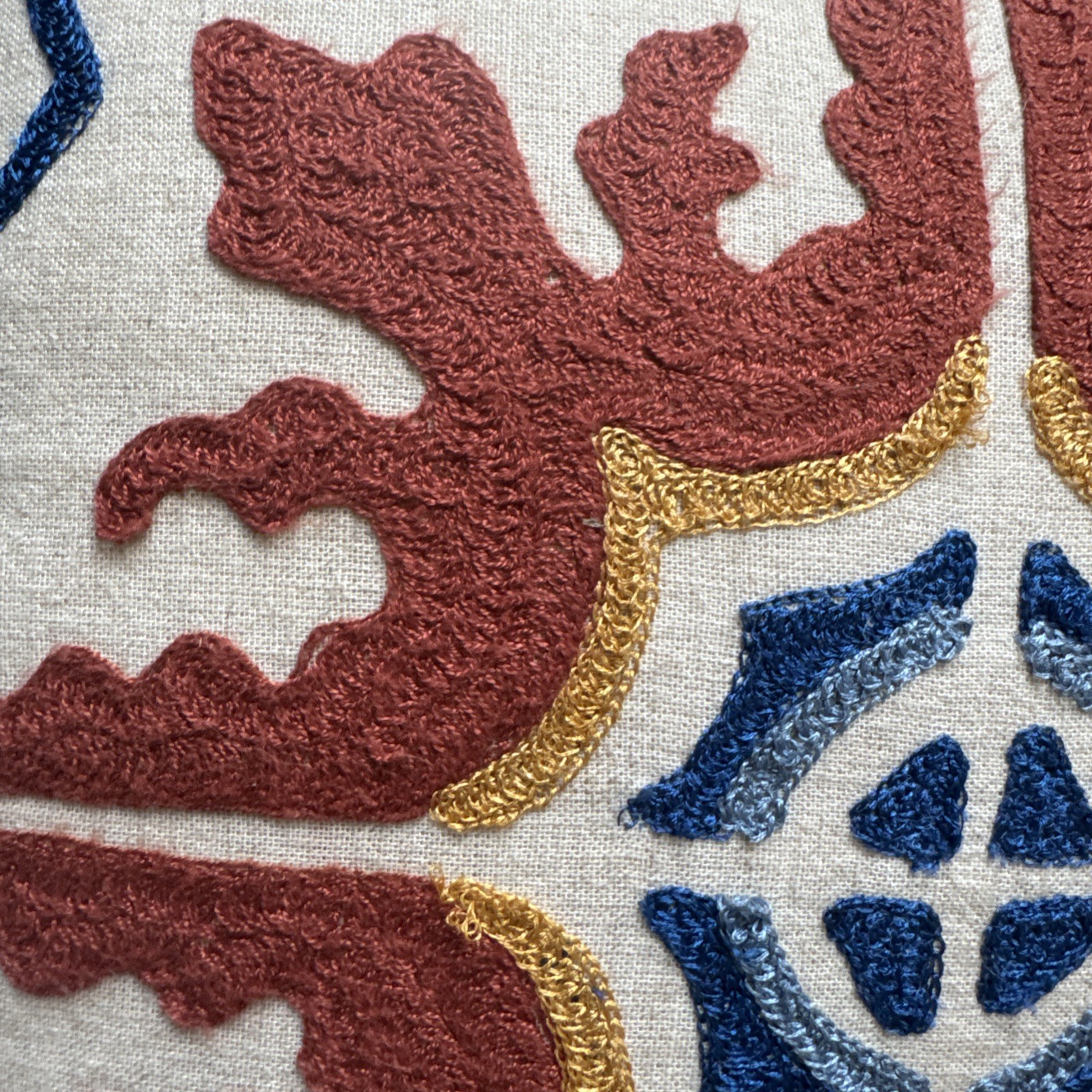 Pier 1 Embroidered Medallion Design rust blue, cream, tan back Throw Pillow gallery