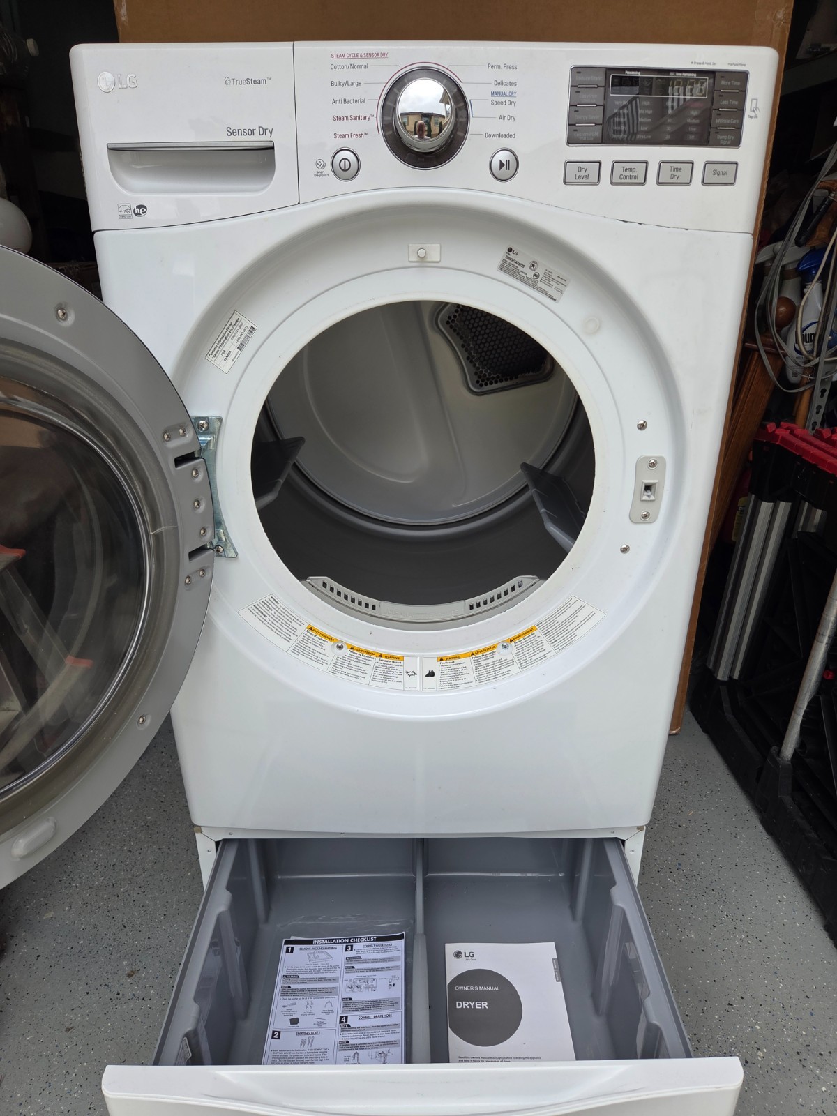 Used LG white front loading gas dryer in very good condition includes stand gallery