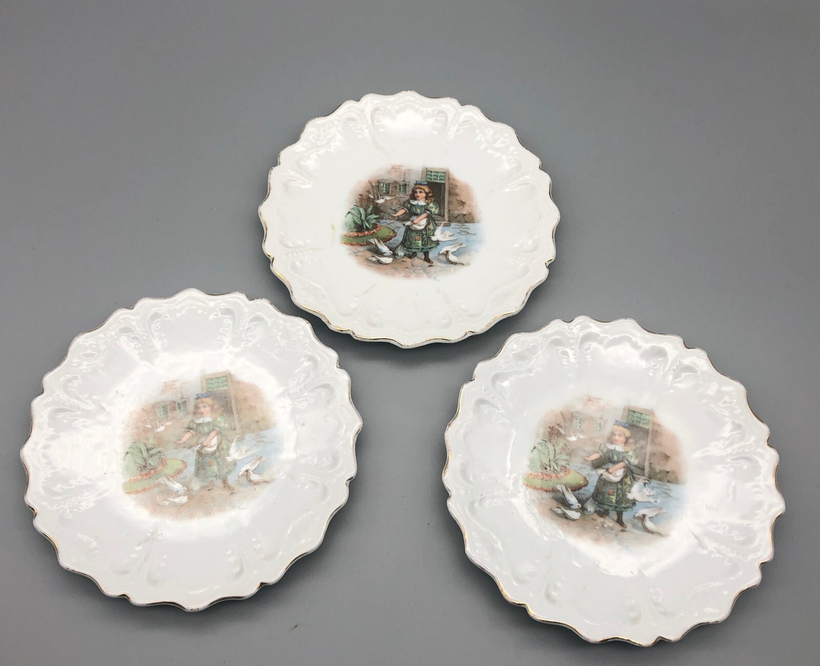 Antique Germany Porcelain Child's Doll Plate Girl Feeding Birds x3 gallery