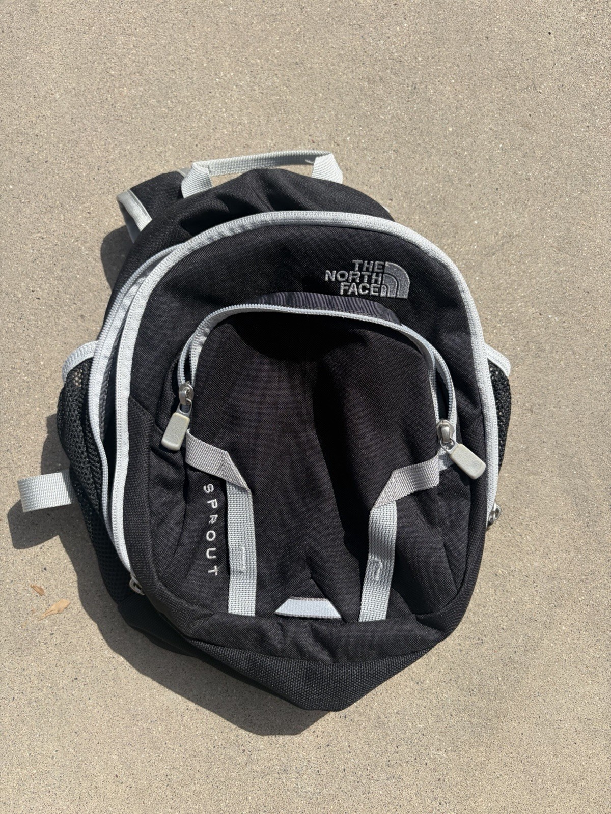 The North Face Sprout Mini Backpack in black and grey Excellent Condition