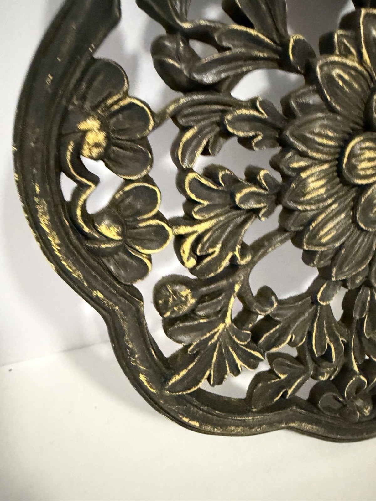 floral wall medallion featuring a black and gold patina finish gallery