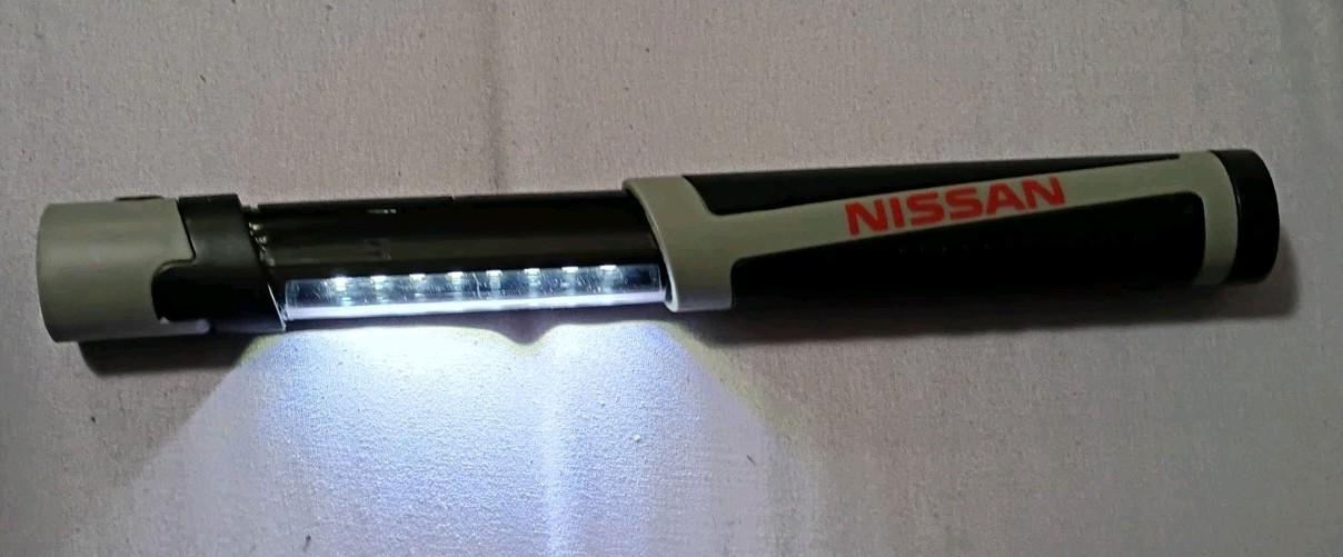 Nissan Extendable Work Light. Magnetic Base. USED. Requires 3 AAA batteries. gallery