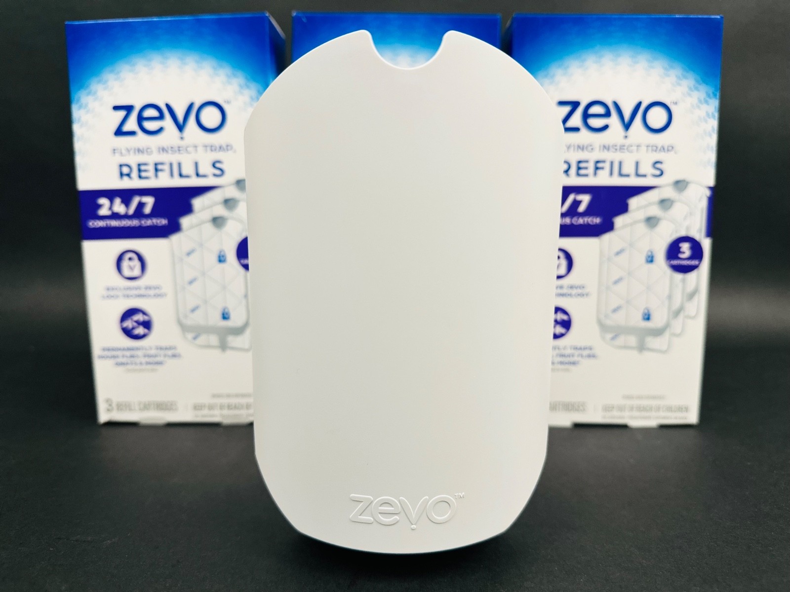 Zevo Flying Insect Trap Starter Kit – 1 Plug-In Device + 9 Refill Cartridges gallery